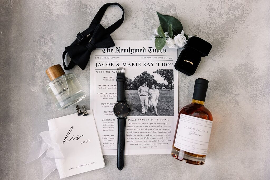 Groom flatlay details with whisky bottle