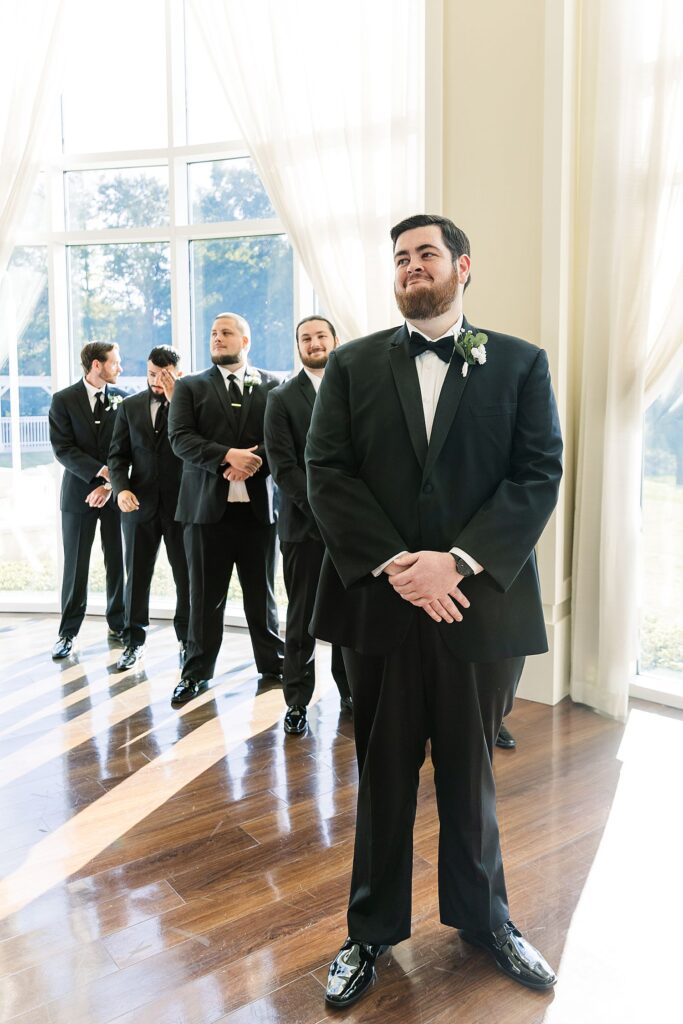 groom first reaction to seeing bride walking down the aisle