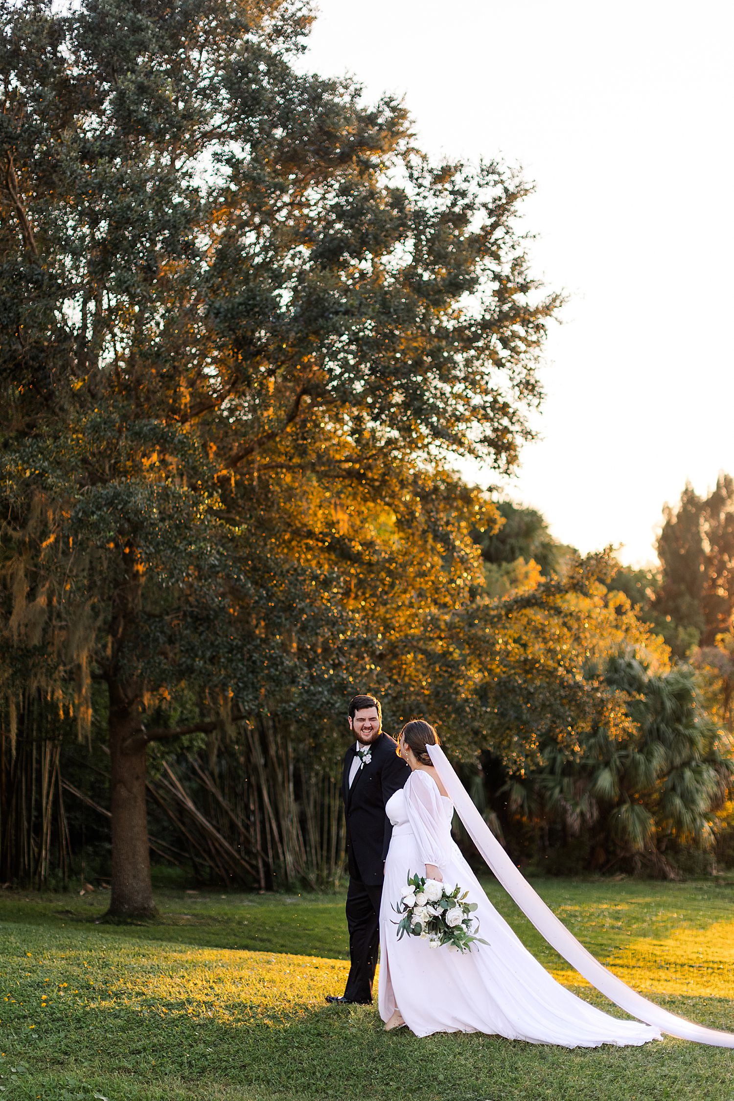 couple walking at sunset at lake mary event center