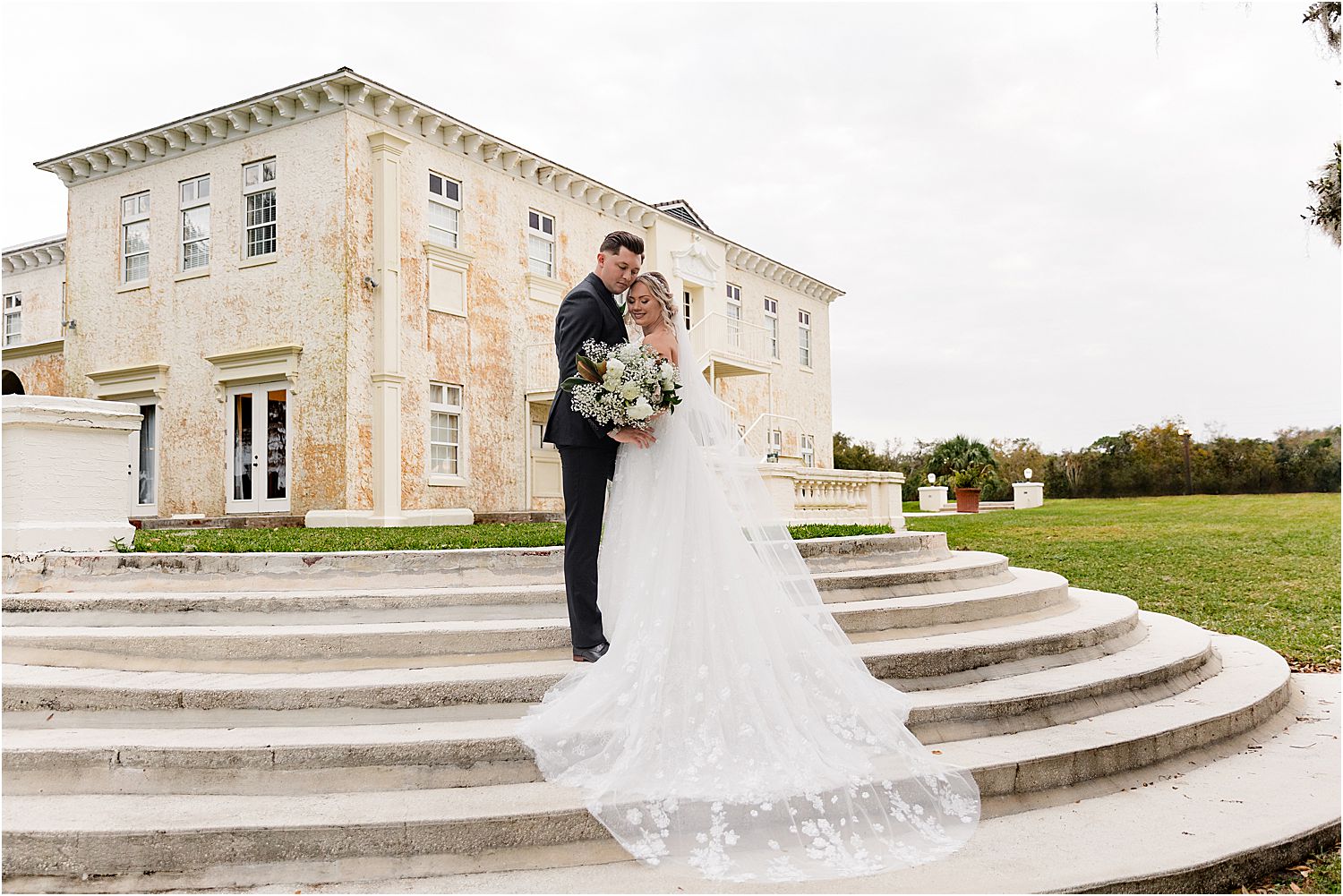 bride and groom portraits on stairs at lake wales florida