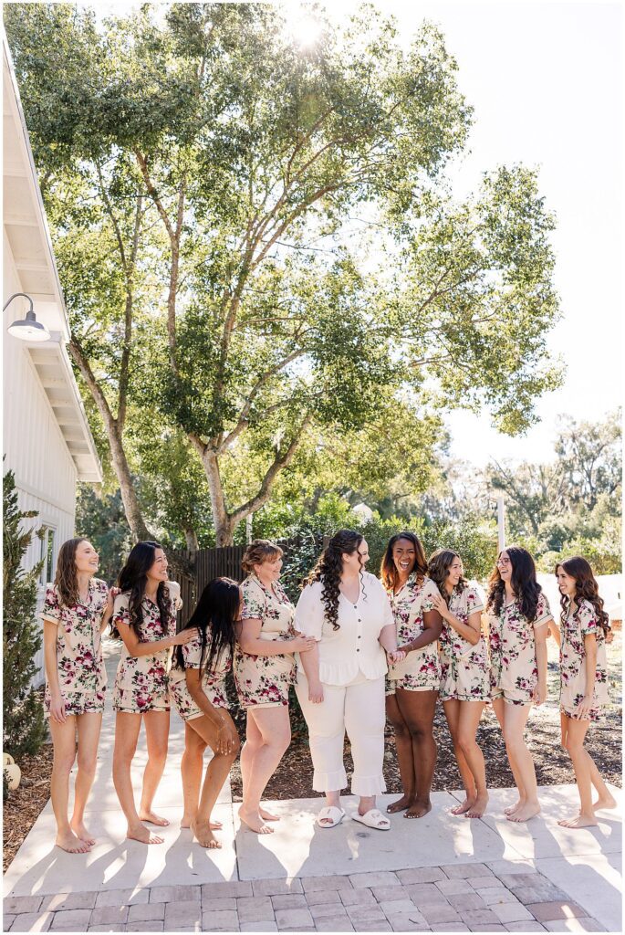 bride laughing with bridesmaids