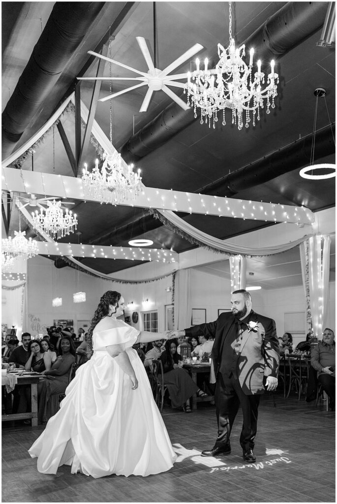 Groom twirling bride at ever after farms vineyard