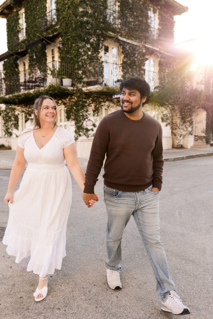 Couple walking together at sunset at Hannibal Square in Winter Park